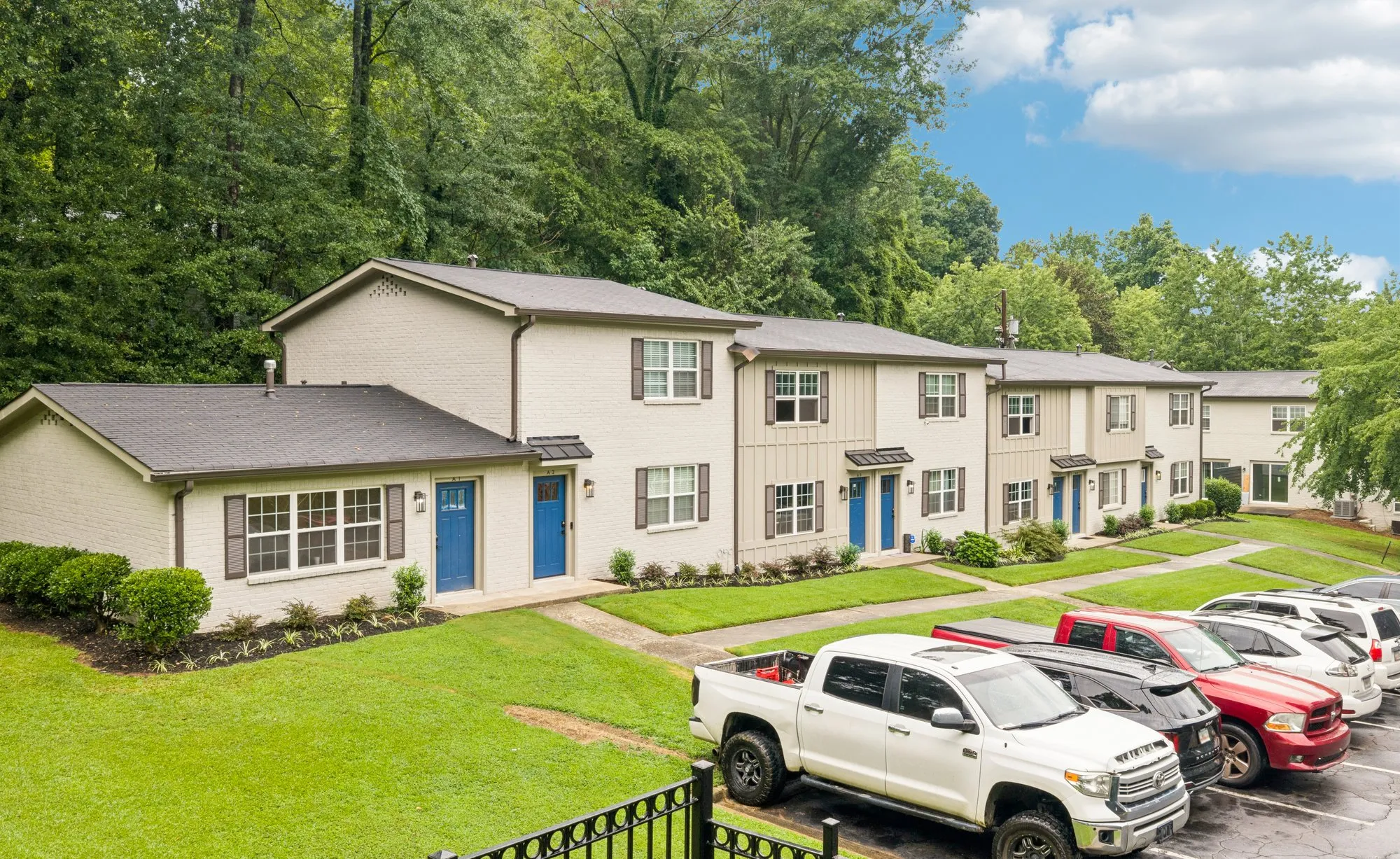 Townhomes with off-street parking out front.